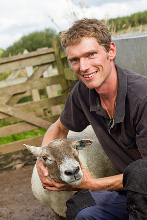 Shepherd in Perthshire, Scotland, posing with a female sheep.