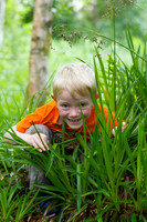 Portrait of a young boy in a woodland in Perthshire, Scotland. An example of my family photography sessions.
