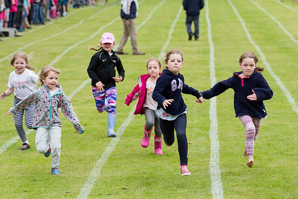 Photo of children running a race at the Kenmore Highland Games, Perthshire, Scotland.