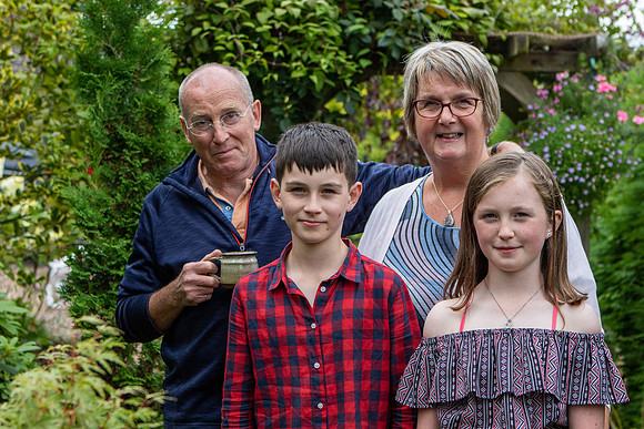 A family portrait of grandparents and their two grandchildren at a home in Aberfeldy, Perthshire, Scotland.
