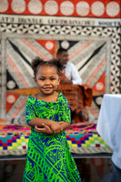 A portrait of a young girl in a traditional green dress from Fiji, taken during traditional Fijian birthday celebrations at Moness Resort in Aberfeldy, Perthshire.
